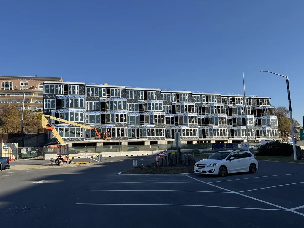 Aquarium Condos exterior construction progress showing nearly completed facade